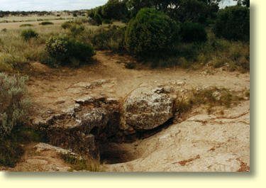 Nullarbor Blowholes breathe in and out as high and low pressure weather systems pass through the area.  The breathing occurs as air pressure equalises between underground passages and the atmosphere.