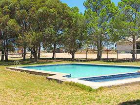 Swimming Pool and grassed areas.