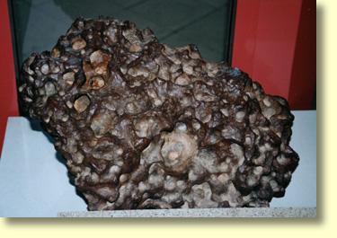 The Kalgoorlie Boulder museum has a large chunk of the Mundrabilla Meteorite on display.  Scientists have classified the Mundrabilla meteorite  as a stony-iron meteorite.